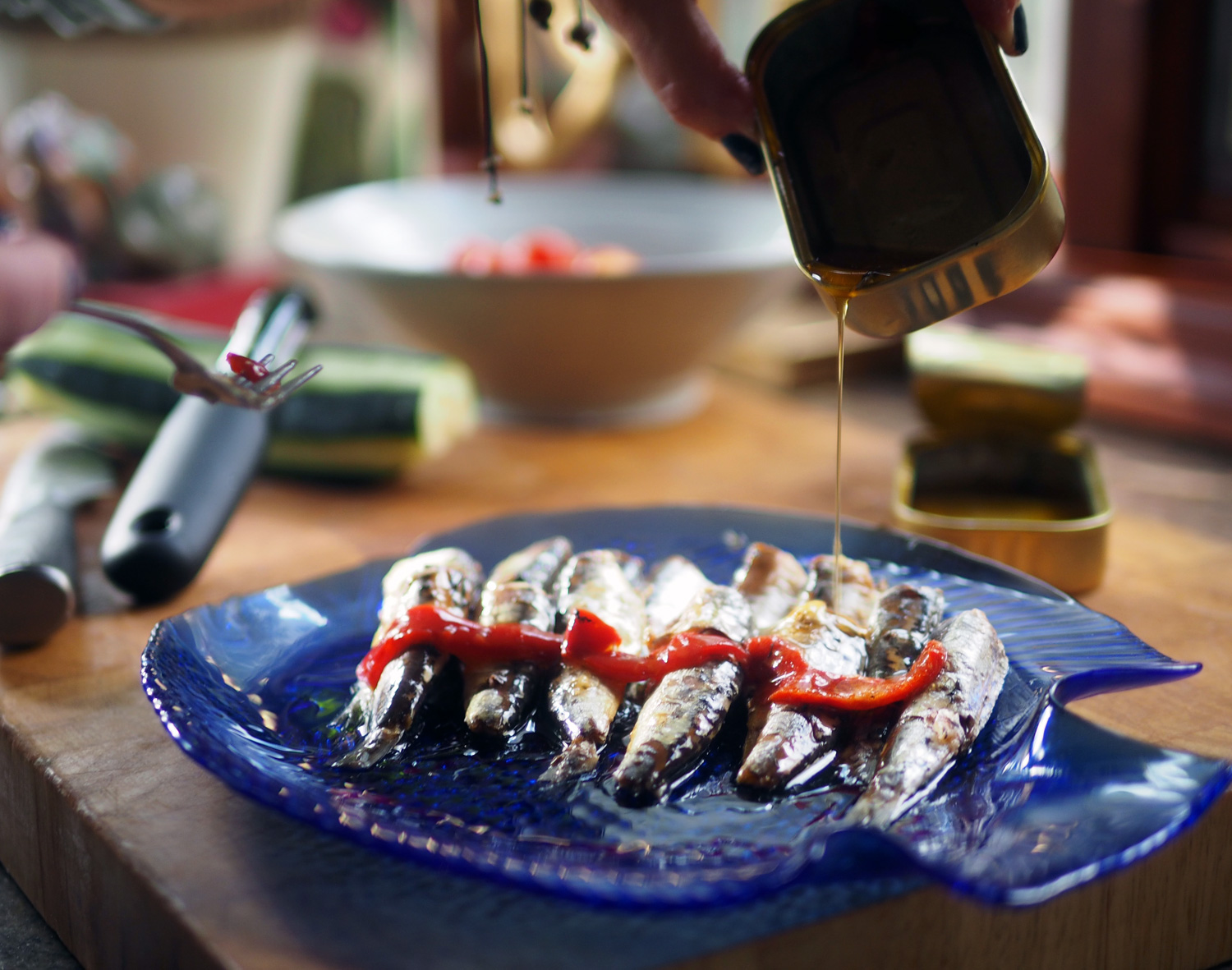 Plate them simply and use the rich oil they are packed in.