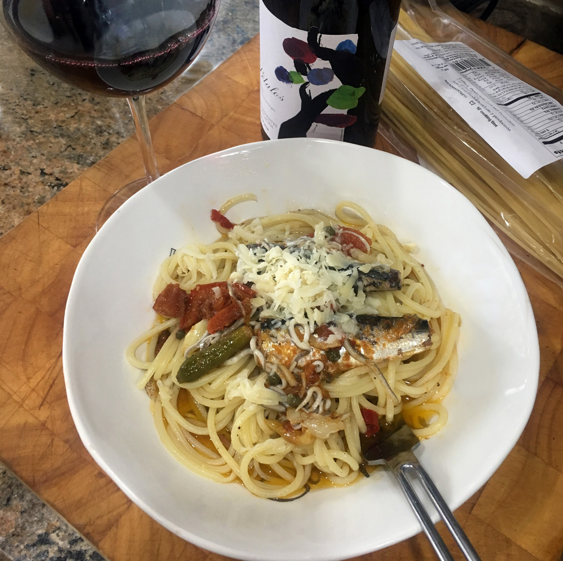 Rich with flavors from the sea balanced with sweetness from the tomatoes paired with Spanish wine from Menica, Petalos