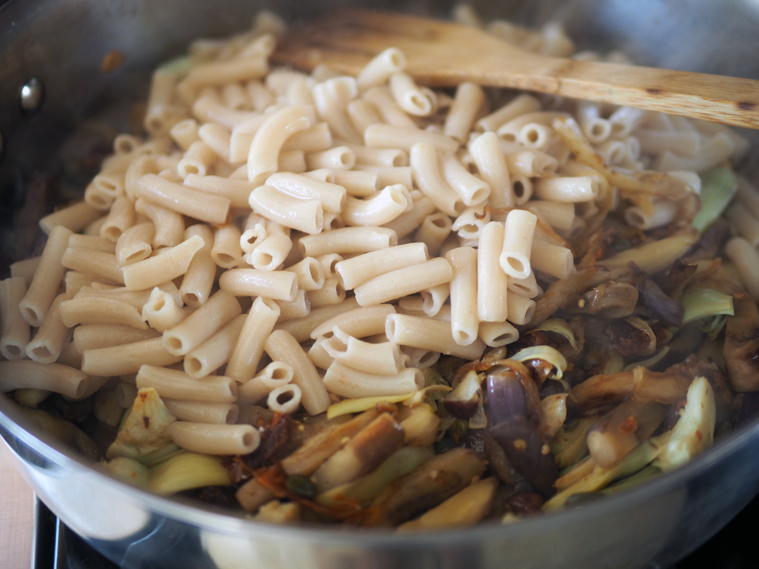 Add the pasta to the mix and stir together. Now is the time to add the pasta water to your liking.