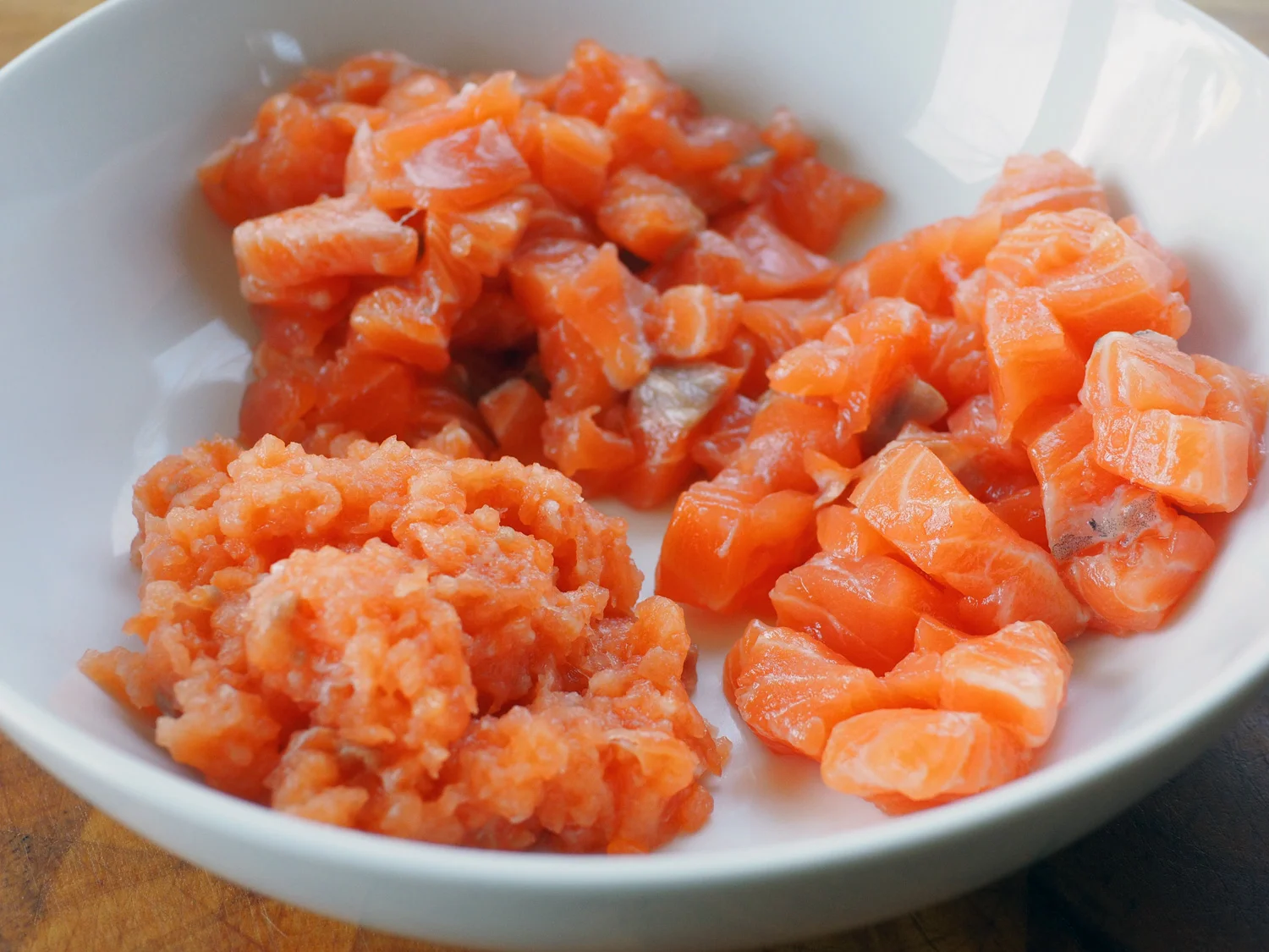 Salmon prepped in 3 sizes: Big cubes, smaller cubes and a paste.