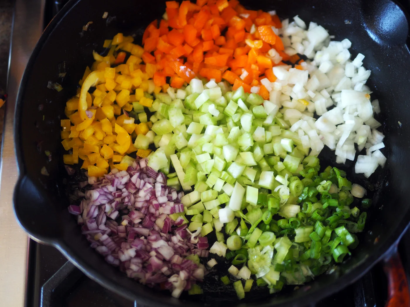 They sure look pretty like this but go ahead and mix them together for even sautéing.