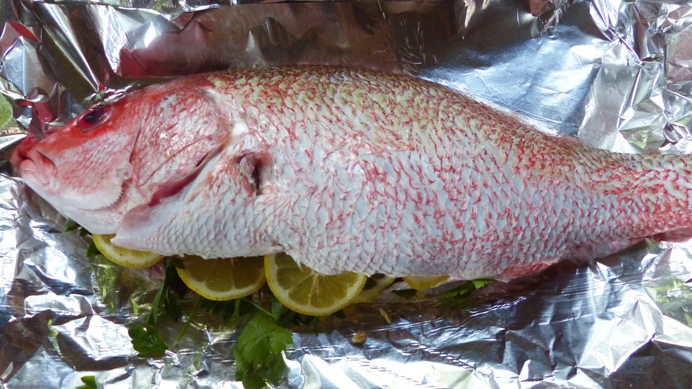 Whole Red Snapper stuffed with lemons and parsley and grilled on the BBQ. So fresh and clean and ideal for a summer night.