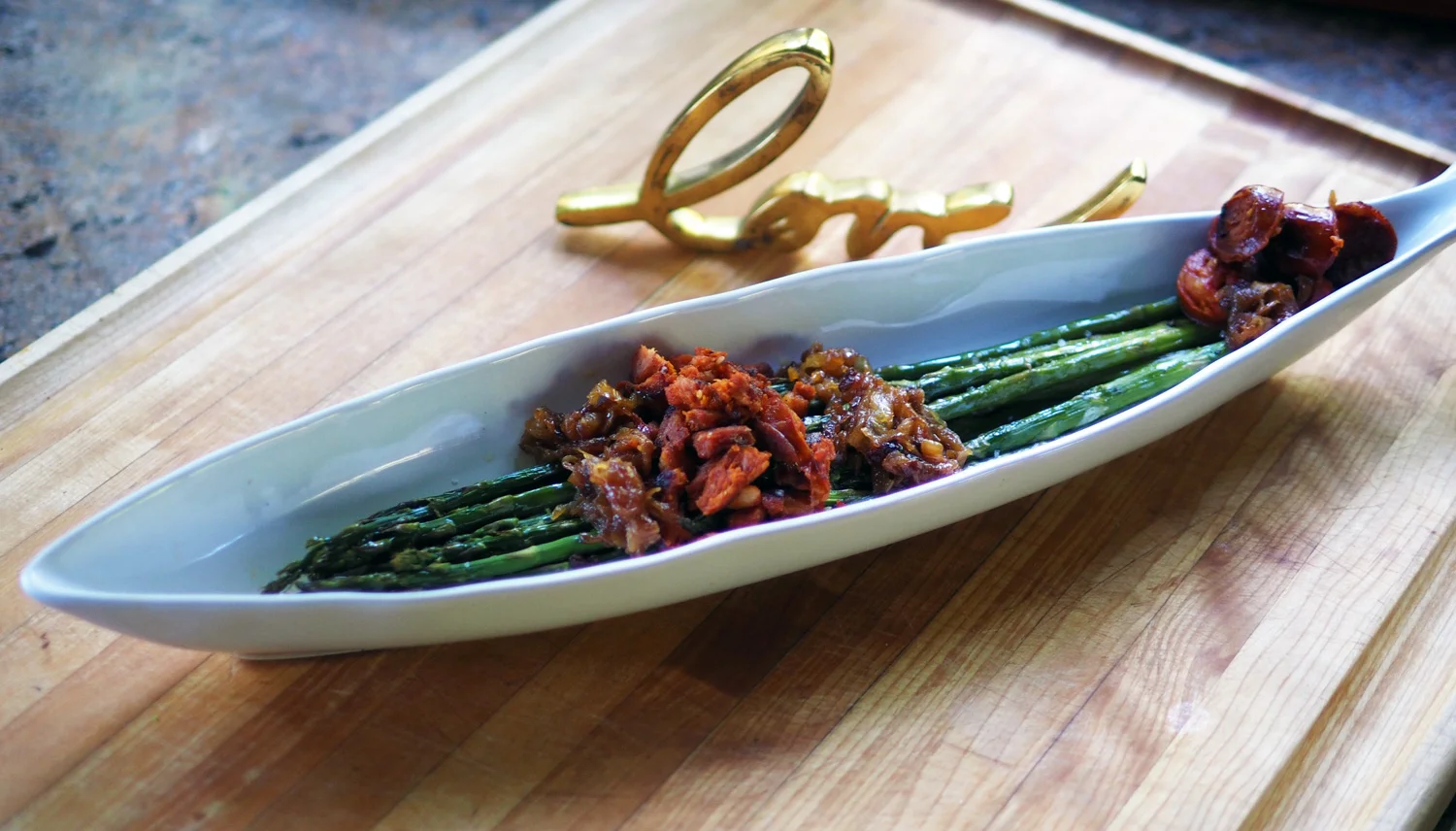 Sauté chorizo and chop into small pieces, add caramelized onions and drizzle of oil.