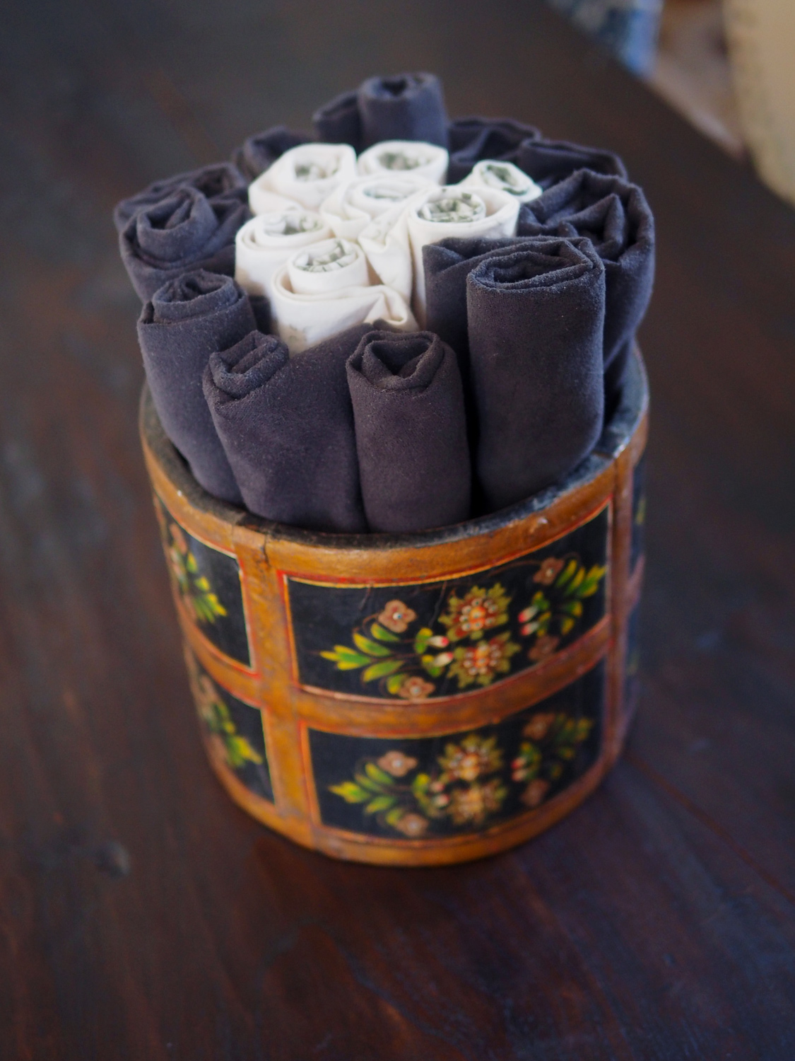 Roll up napkins and place in decorative bucket.
