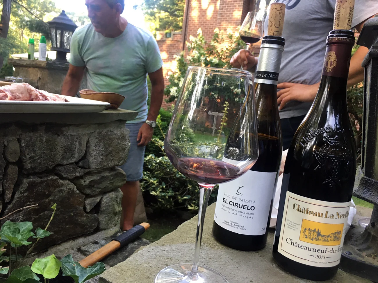 JuanCarlos manning the grill, fortified with hydration. Photo credit: Angelica Intriago