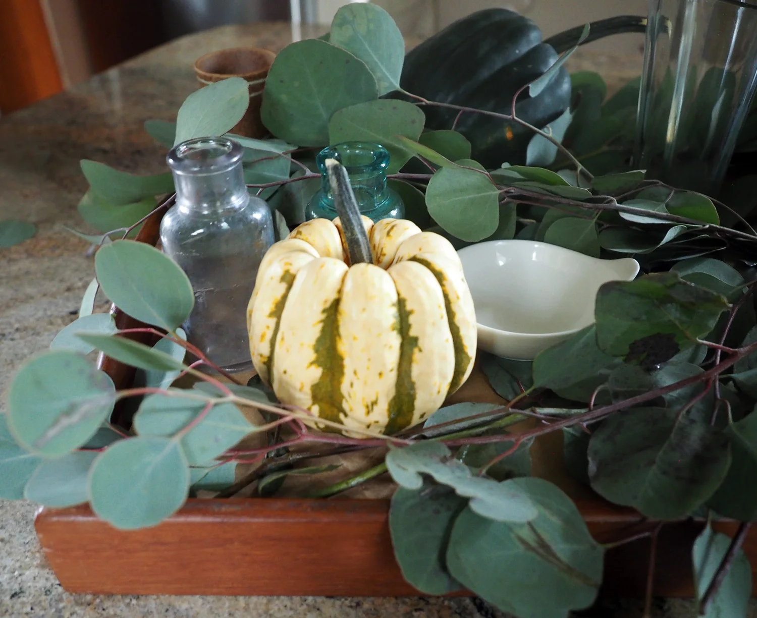 Yellowy, green pumpkin added a nice pop of color amongst the green leaves.