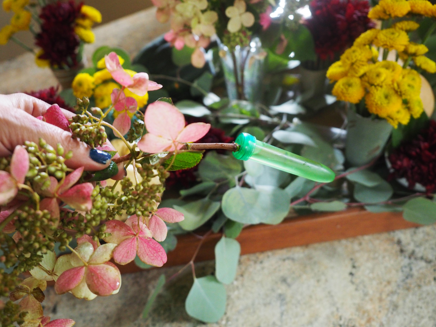 Use the water phial to hydrate the hydrangea. Then tuck it in wherever feels right.