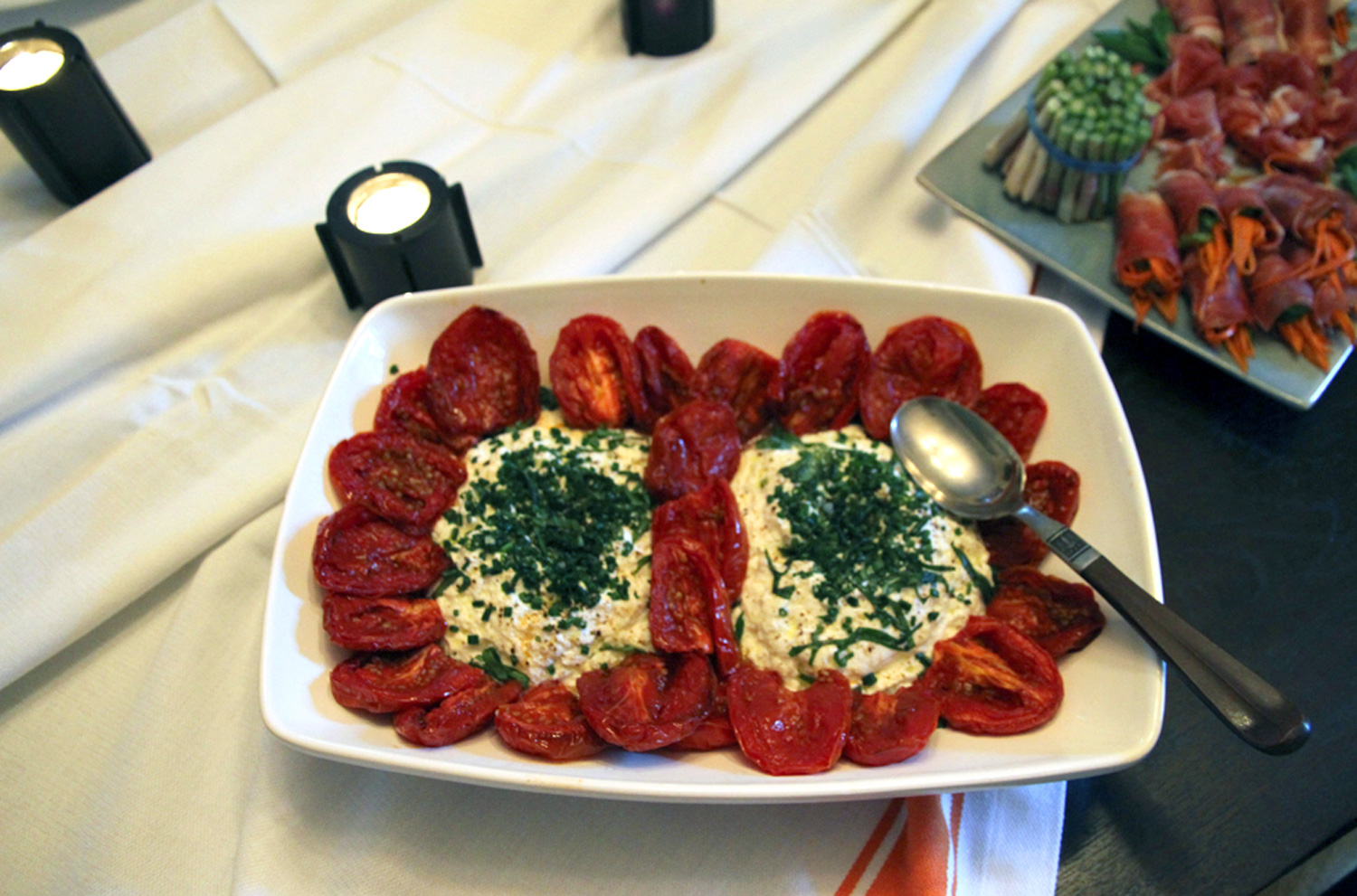 This combo of sweet tomatoes with fresh creamy ricotta is one that will keep your guests coming back for another smattering.