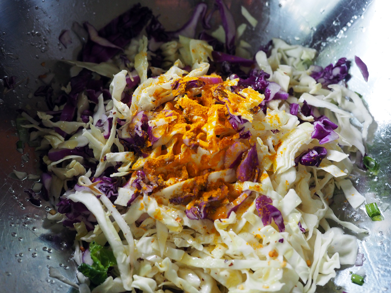 Cabbages getting turmeric-ed and spiced.