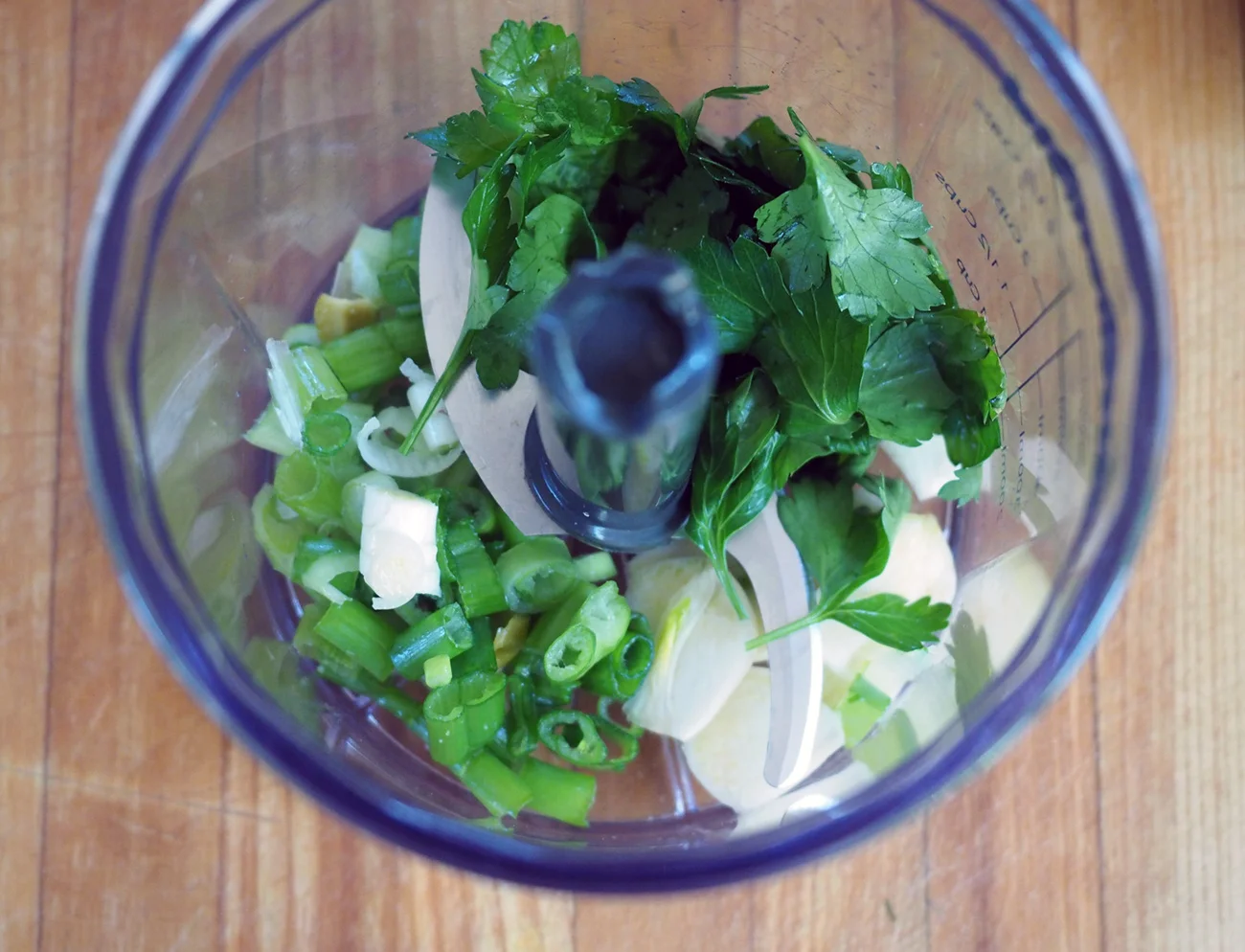 Toss the scallions, garlic and parsley in.