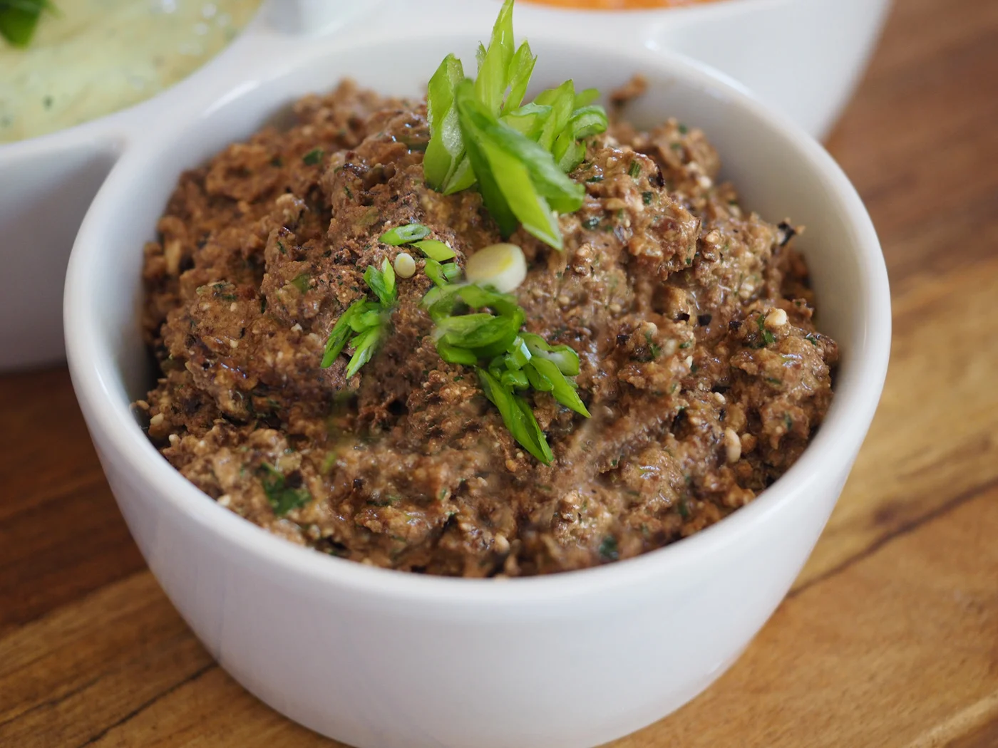 Olive tapenade with feta is a hearty dip, perfect with boiled potatoes for dipping.