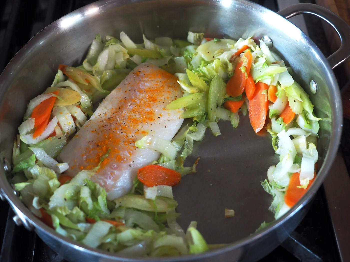Make a nice resting spot for the fish to reside while they cook in the oven.
