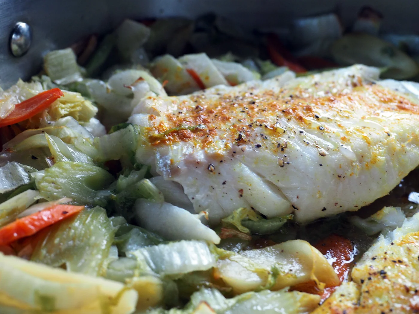 Delicate, mild and flaky, this lightly spiced fish melts into the softened vegetables perfectly.