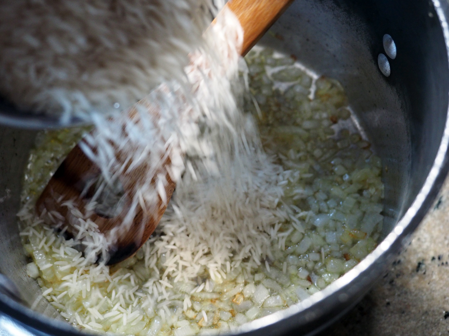 The onions only need to softened, then in goes the rice, then quinoa so they can toast and absorb some of the sweet onion and oil flavor.