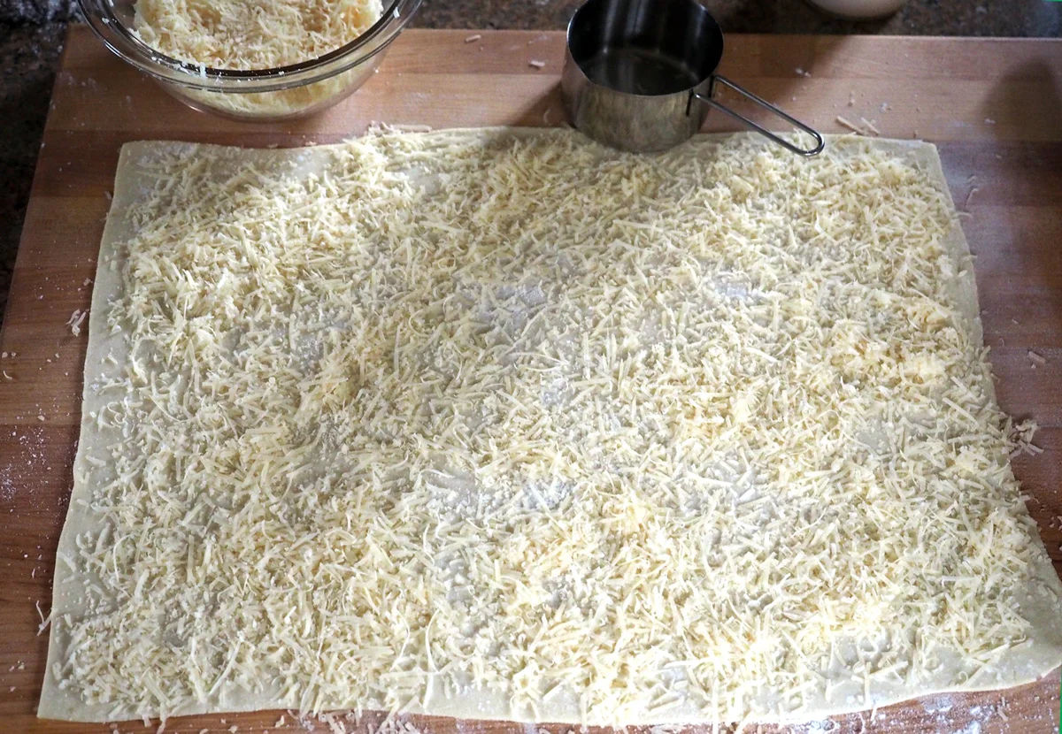 Cover the entire surface. You’ll want cheesy goodness in every bite.