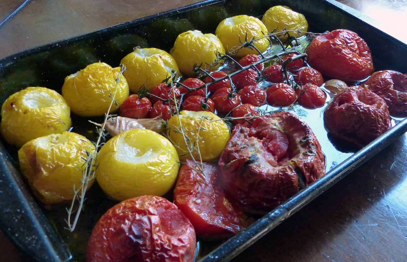 Oven roast tomatoes and serve as a side dish with fish and rice or any other grain.