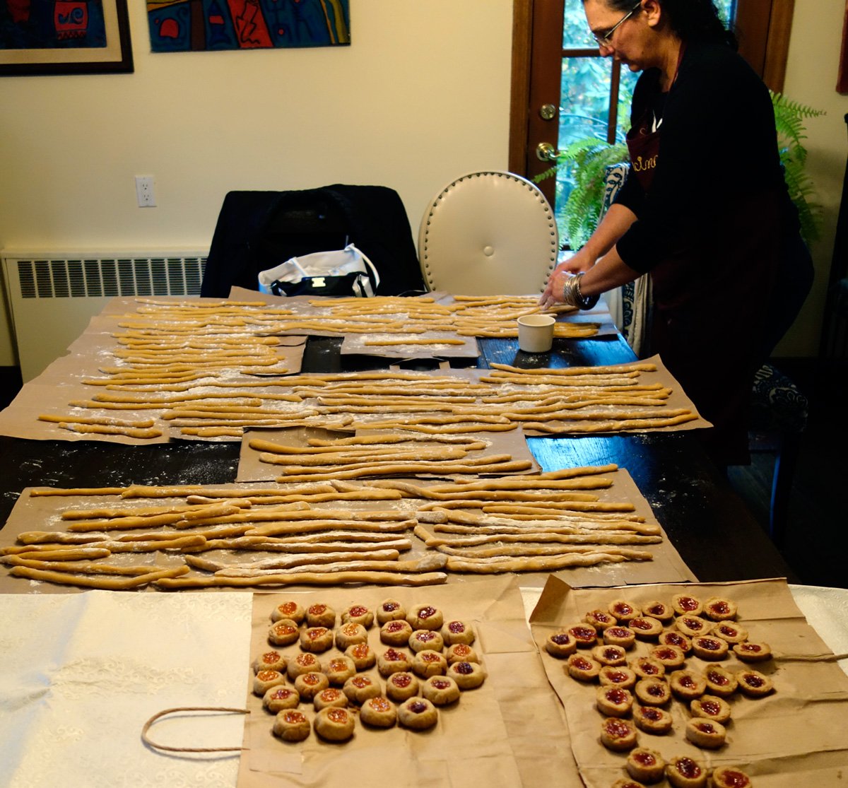  Rows and rows of paper dusted with flour serve as the drying station for the stuffoli before they get cut. 