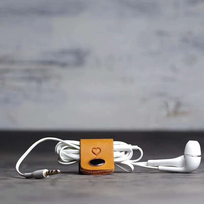 Keep it together (or at least keep your earbuds from tying themselves into a hundred knots) with one of these gorgeous cord wraps from Ox&Pine . 