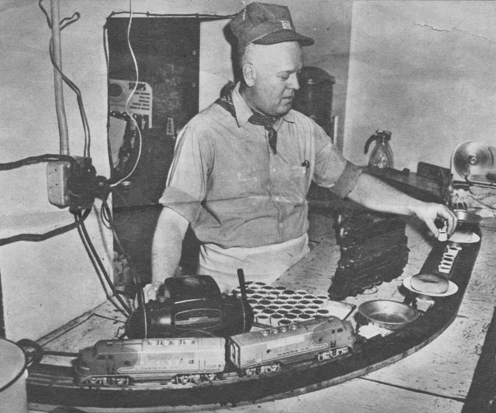 James Ballowe, who operates Choo-Choo Restaurant at Des Plaines, Ill., loads a catsup car of "Hamburger Limited" which bears food to patrons from kitchen.