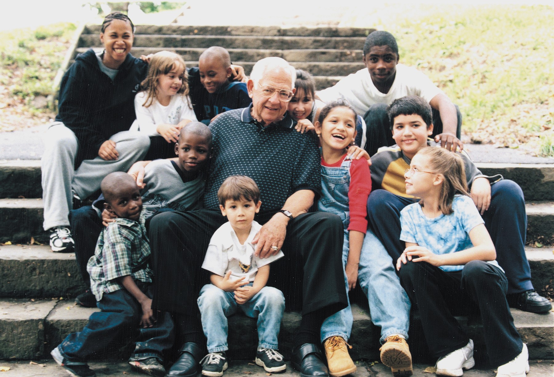 Dave Thomas poses in new york city with children in foster care