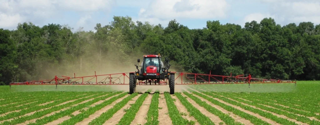Tractor Spraying Vegetables