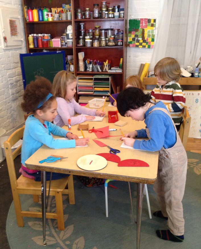 Kindergarten students work on their morning lesson.