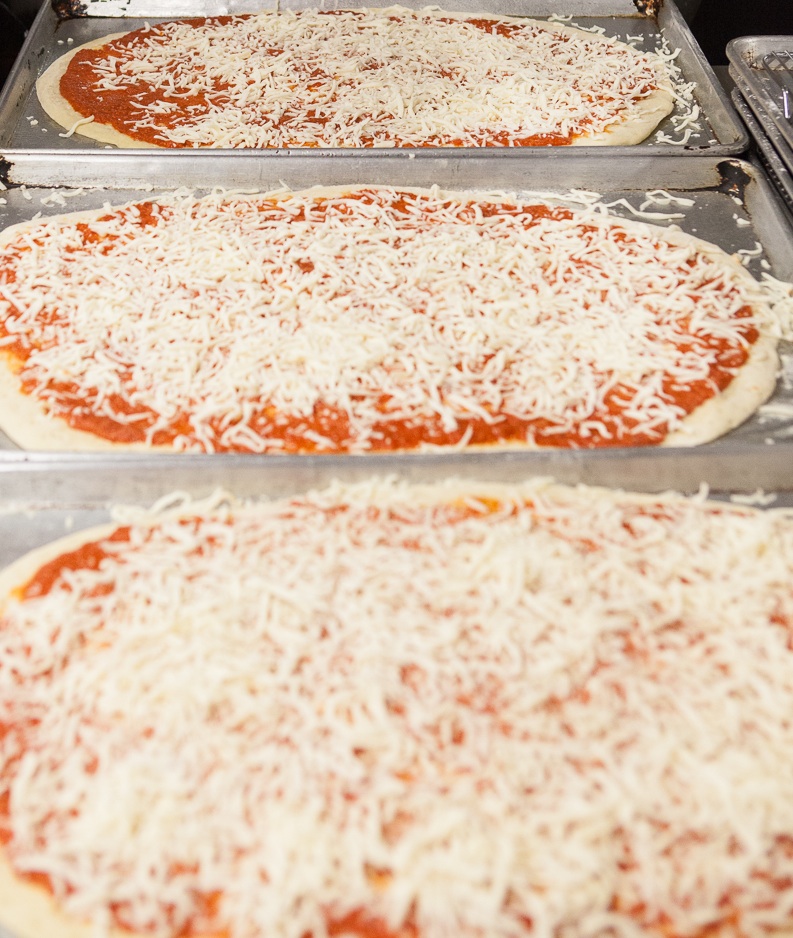 mana-foods-deli-pizza-preparation copy.jpg