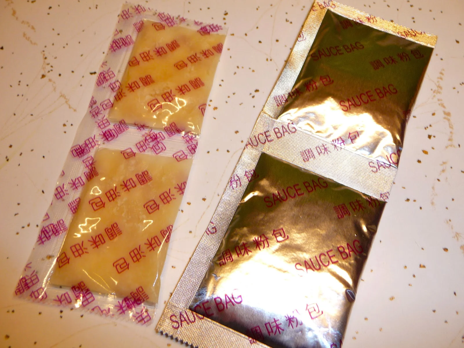 It comes with the usual foil packets of dry flavoring, but also packets of congealed fat to add in. Use them - it makes a big difference!