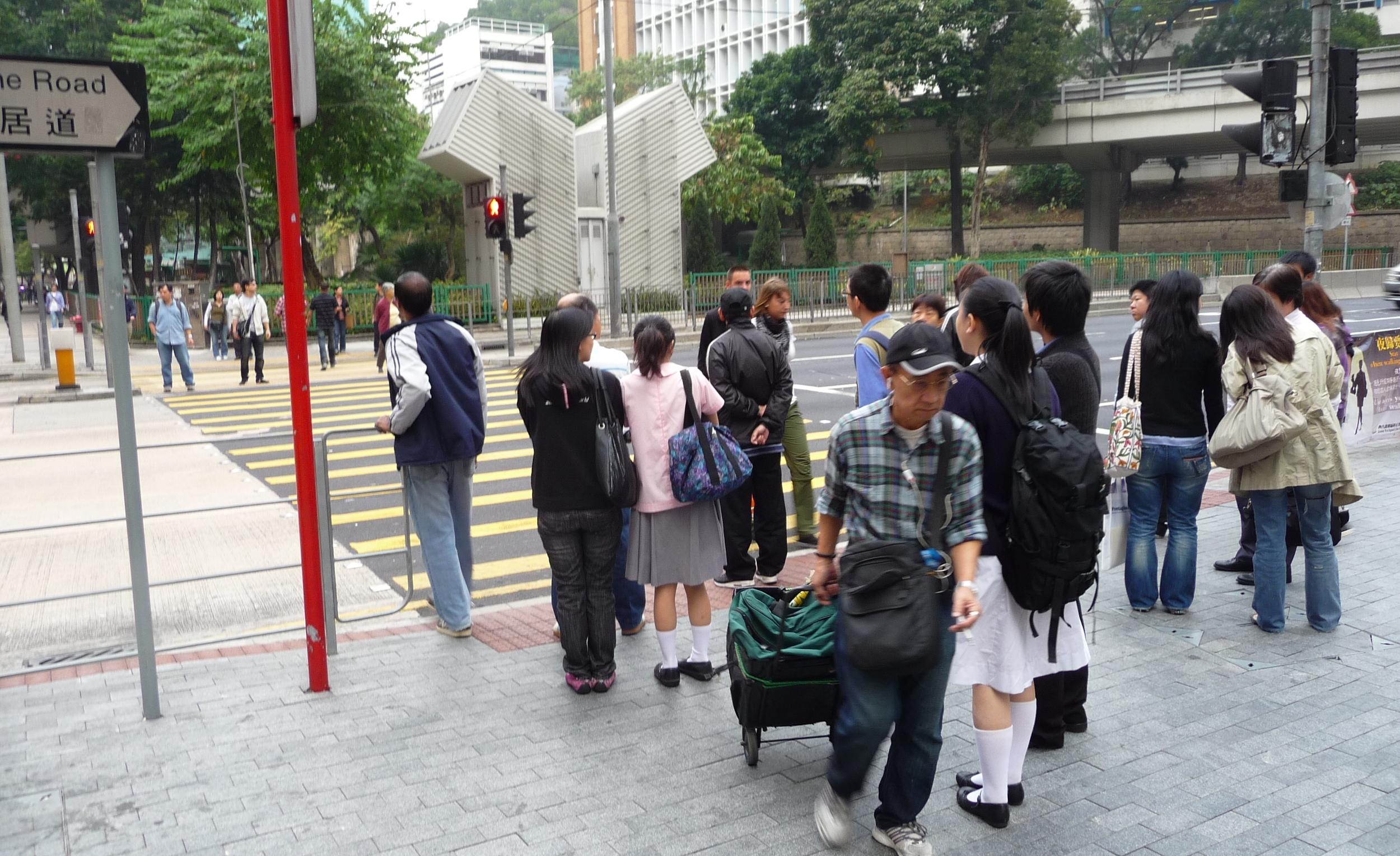Which way is traffic coming from? It's Hong kong, which used to be British, so the cars are coming from your right. If this were Mainland China, they'd be coming from your left.