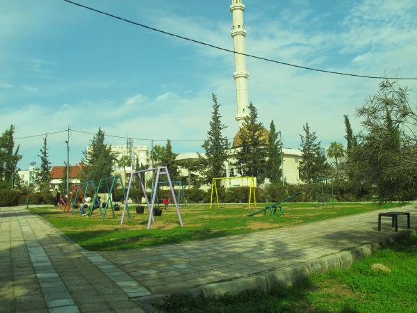   View of the park’s play area taken from the south showing Salah al-Din Mosque in the back   لقطة للحديقة مأخوذة من الجنوب يظهر فيها مسجد صلاح الدين في خلفية الصورة  