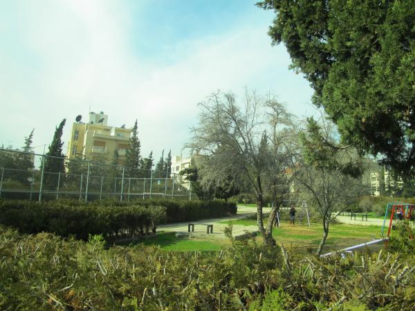   View of the park taken from the south-east showing part of the football court and part of a play area    لقطة للحديقة مأخوذة من الجهة الجنوبية الشرقية يظهر فيها جزء من ملعب كرة القدم وجزء من مساحة اللعب  