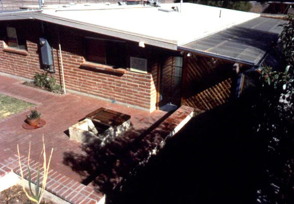 Figure 2: A view of the backyard of Casa del Agua that shows the concrete paving and extended rooftop.
