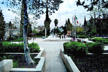 The central plaza of the National Gallery Park. The plaza includes a shallow water channel and grills opening to the park's underground water reservoir.