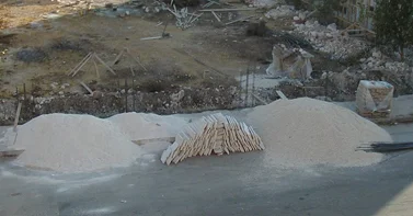 A typical construction site in Amman with construction materials placed on the adjacent street. (Mohammad al-Asad)