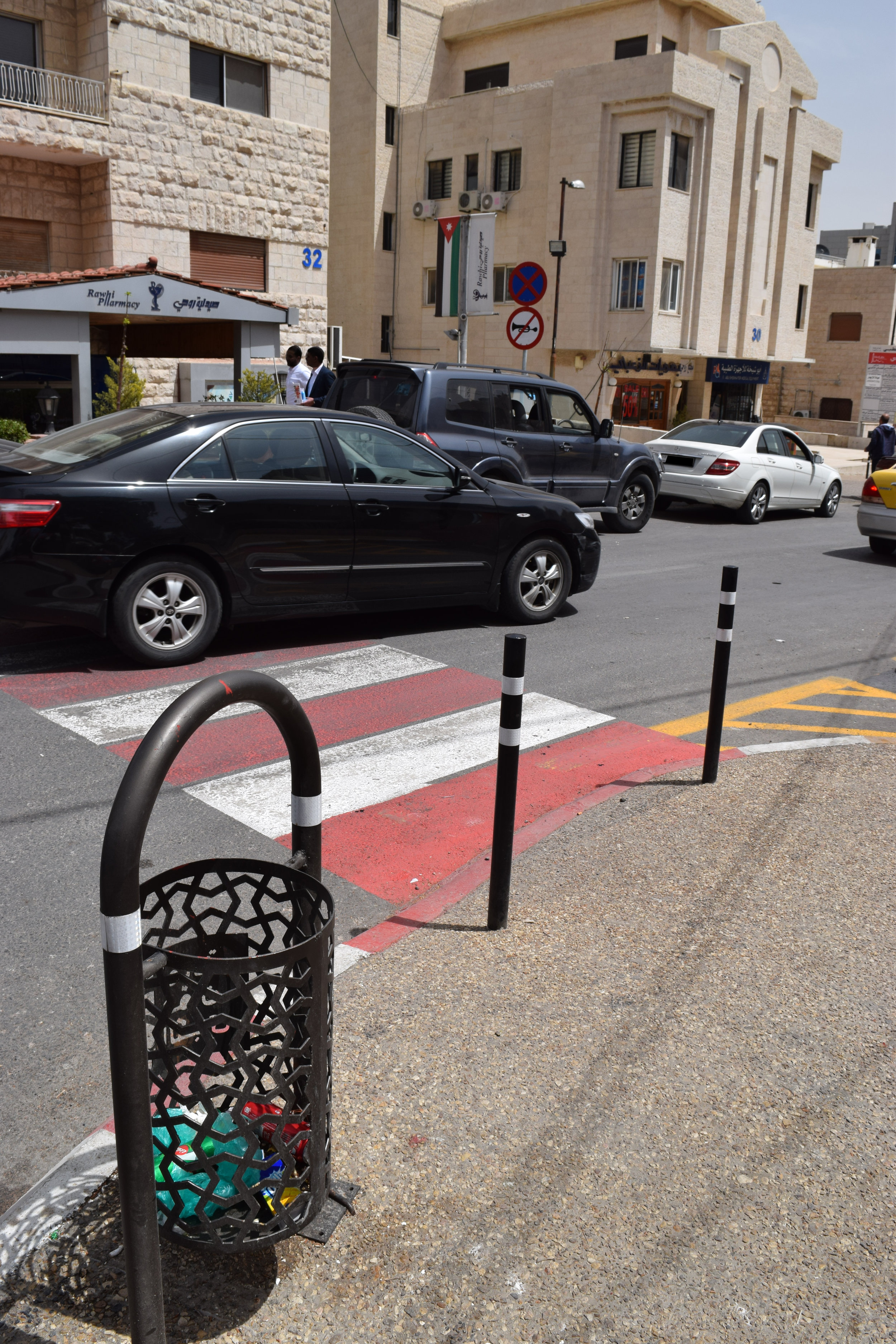  Low poles have been installed to prevent cars from parking on the sidewalk; and the street has been provided with new waste bins. 