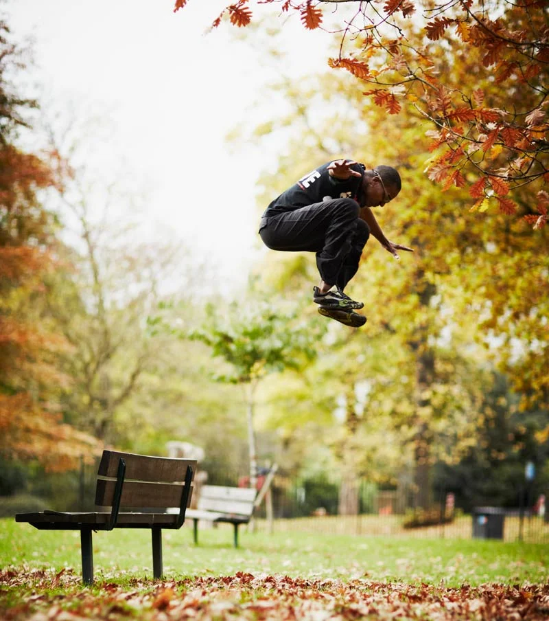 Darryl Edwards performing a jumping movement outdoors as part of the Primal Play Method®