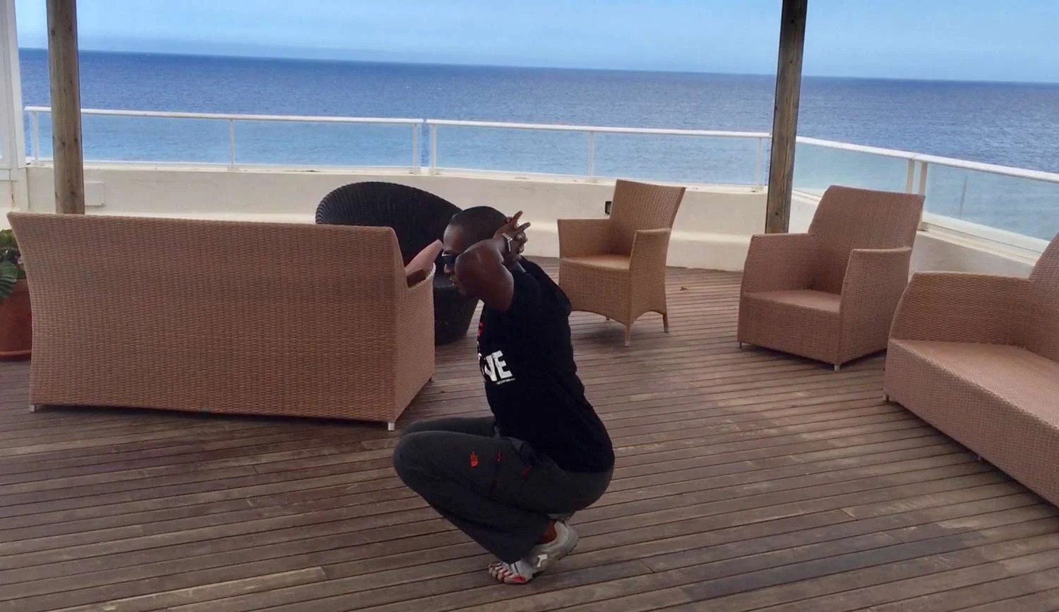 Darryl Edwards demonstrating the low-squat starting position for the Bunny Hop Animal Moves exercise