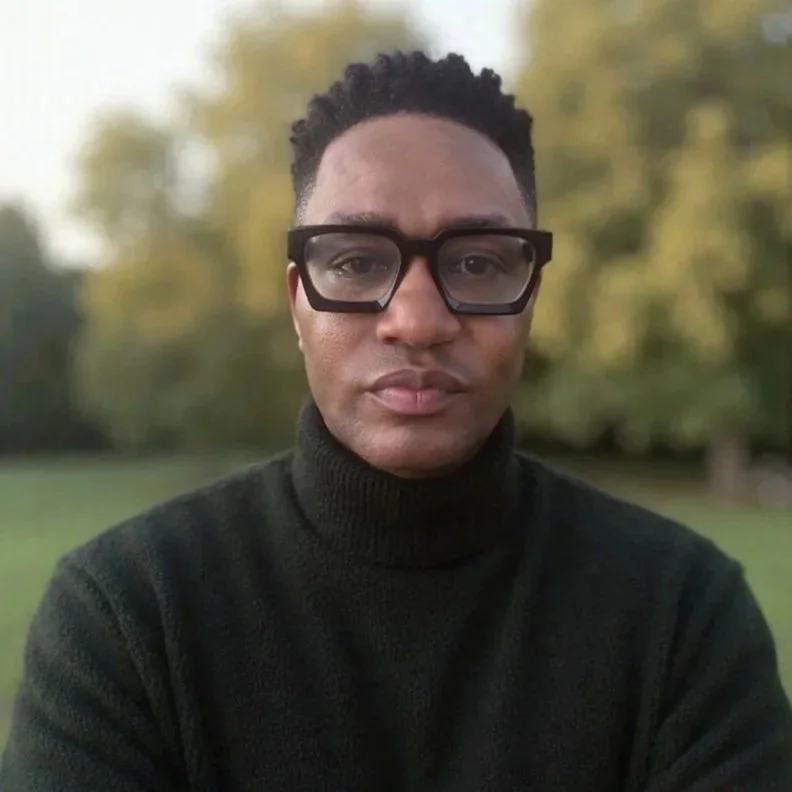 Headshot of Darryl Edwards, movement coach and exercise medicine specialist, outdoors looking directly at the camera