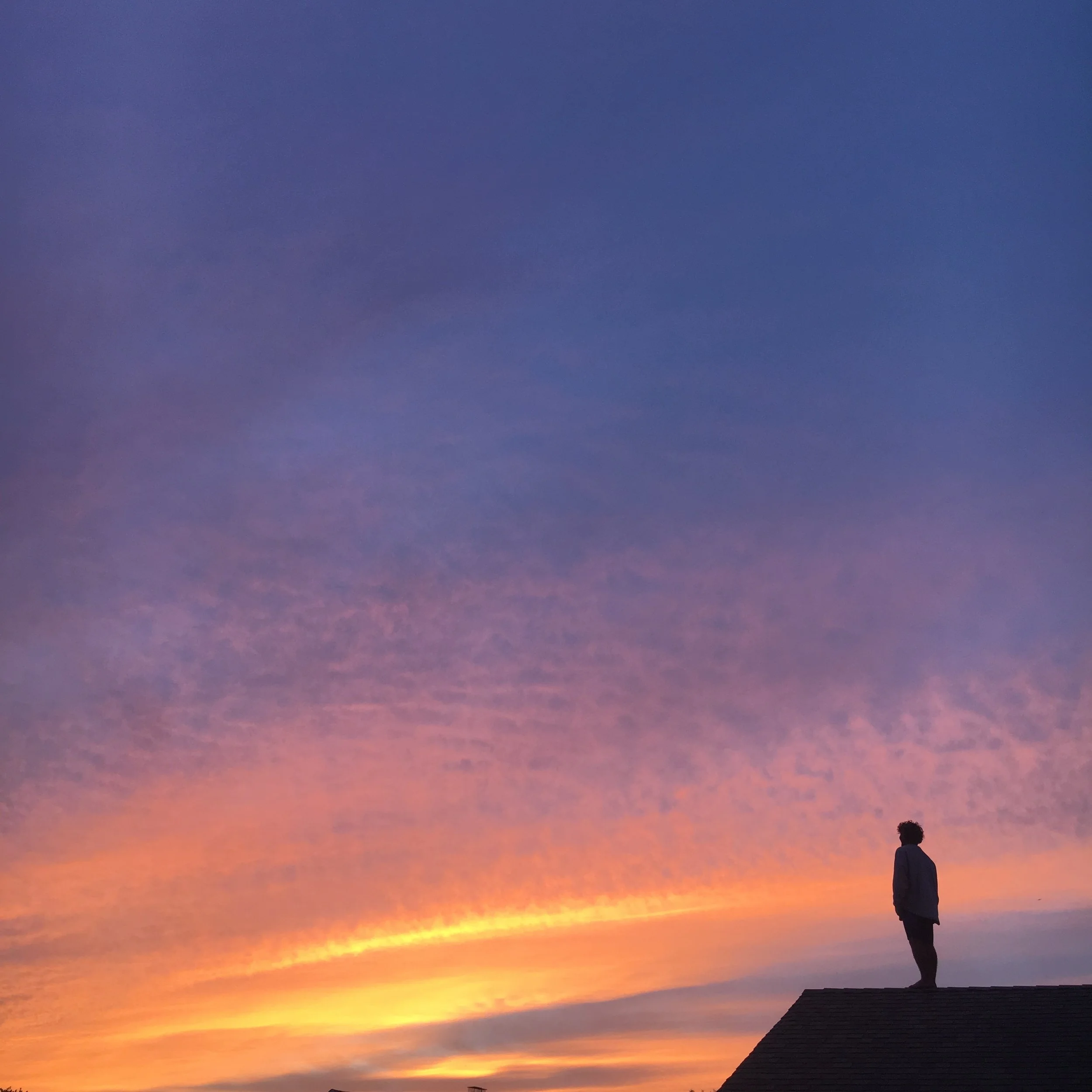 Kevin on MTK roof Sunset.JPG