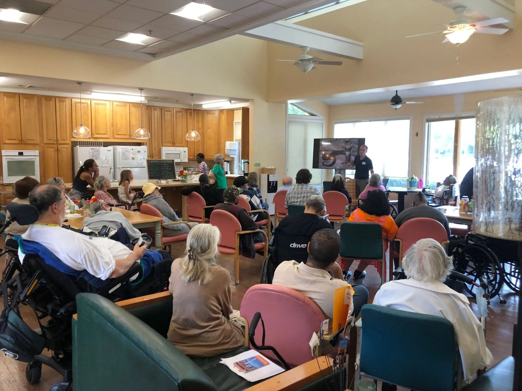 William gives a lecture at an elderly home in the US.