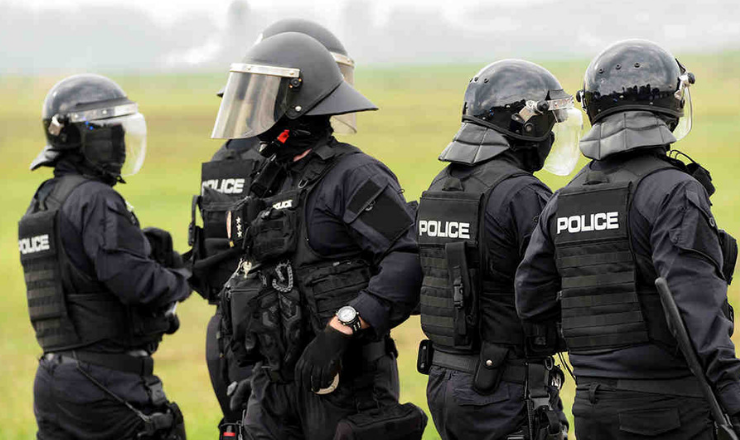police in riot gear and armor.png