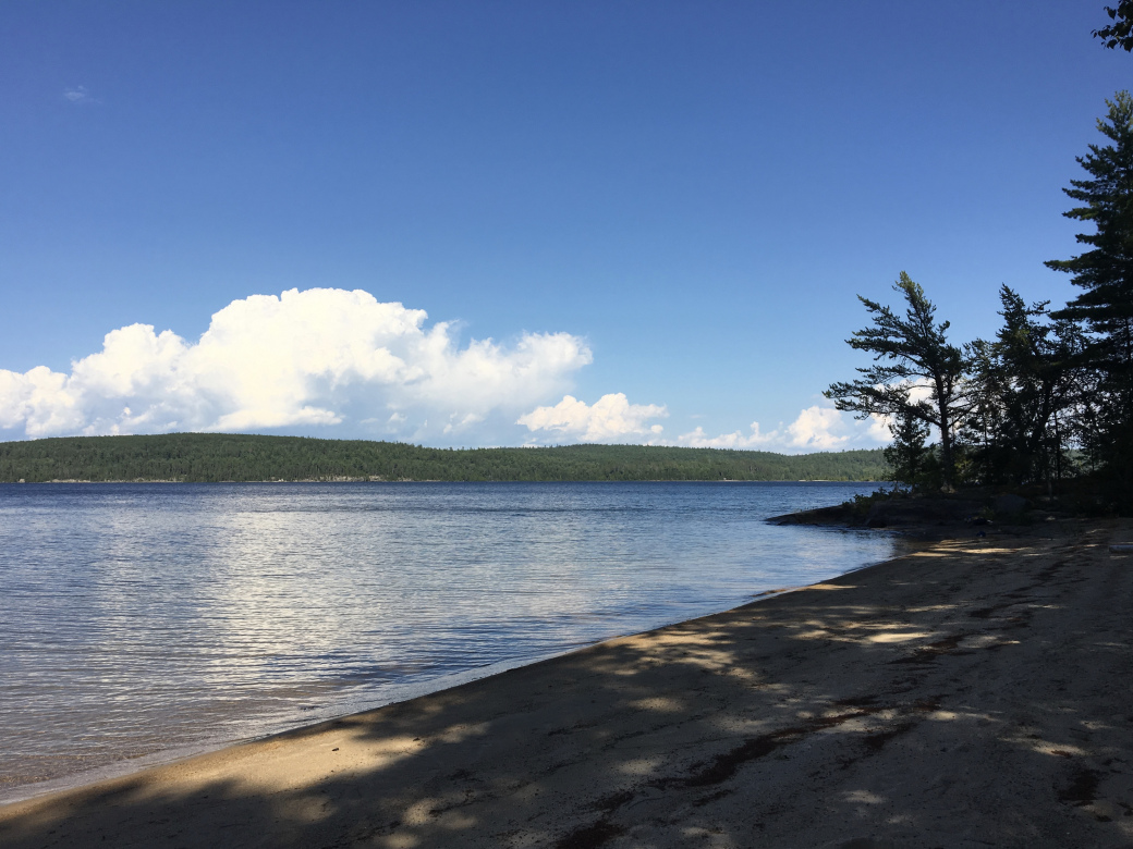 looking across to ranger point from the beach. you can just barely make out the white prospector tents of outpost co in the background
