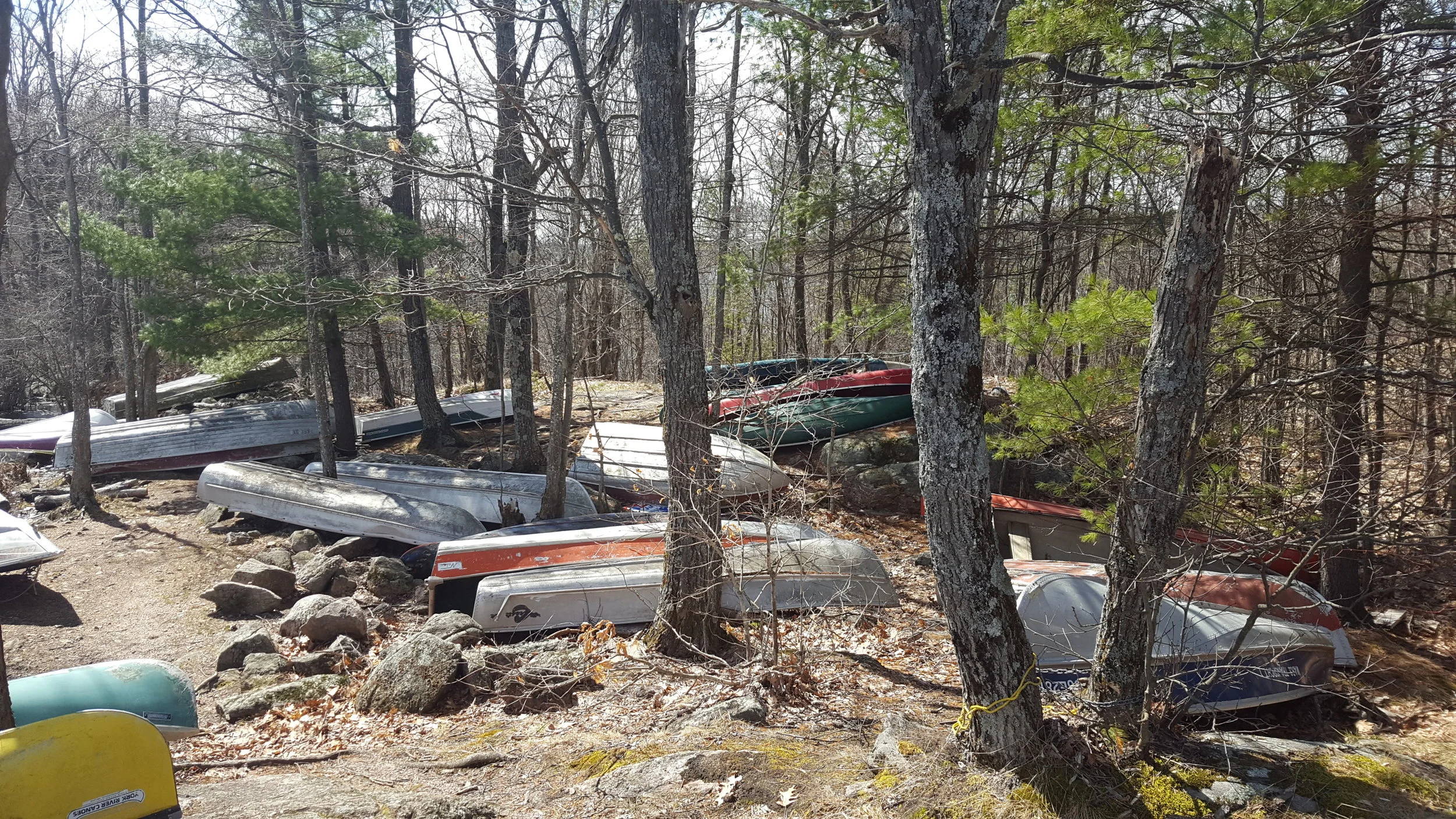 Canoes left at Rathbun Lake from cottagers on Anstruther Lake