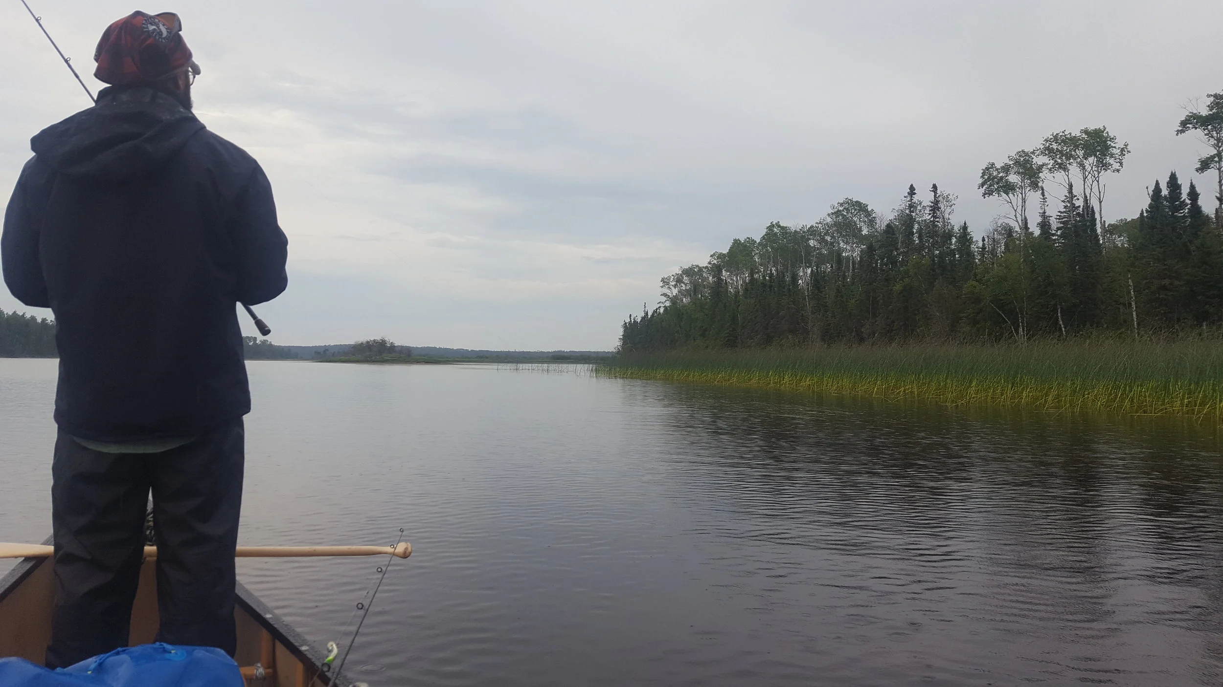 Noah trying to find the monster pike that hit his lure and took off - Ogoki River