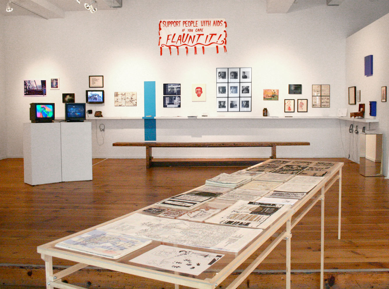 NOT OVER: 25 Years of Visual AIDS , 2013, curated by Sur Rodney (Sur) and Kris Nuzzi for Visual AIDS. The exhibition looked back at the history of Visual AIDS and contemporary AIDS politics to create a glimpse into a quarter century of AIDS, art and activism, linking artists of a generation born after 1970 to an earlier generation of artists that were active in the 1980s.By creating these layered connections and presenting artwork by both historical and contemporary artists, the exhibition aimed to add to the ongoing dialogue and position the work within a layered timeline of AIDS, art and culture, using art as a means to educate, encourage discussion and inform that AIDS IS NOT OVER.Artists include: Albert J. Winn, Aldrin Valdez, Andreas Senser (1942-1989), Arch Connelly (1950-1993), Barton Lidice Benes (1942-2012), Bern Boyle (1951-1992), Bizzy and Devon Gallegos, Brian Weil (1951-1999), Camilo Godoy, Carlo Quispe, Charlie Ahearn, Chloe Dzubilo (1960-2011), Charles Ryan, Copy Berg (1951-1999), Daniel McKernan, Edith Alverez, Eric Rhein, Ethan Shoshan, Frank Moore (1953-2002), Harvey Weiss and Marc Happel, Derek Jackson and Hi Tiger, Hugh Steers (1963-1995), Hunter Reynolds, Hayat Hyatt, J. Morrison, Jack Waters and Peter Cramer, John Sex (1956-1990), Karen Finley, Kate Huh, L.J. Roberts, Martin Wong (1946-1999), Michael Slocum (1956-1995), Nancer LeMoins, Nicholas Moufarrege (1948-1985), Pato Hebert, Rafael Sánchez, Rebekah Dewald and Demetrea Dewald, Ryan Conrad, Ted Kerr, Tim Greathouse (1950-1998) and Vincent Chevalier MEDIA .