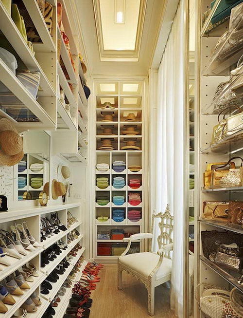  This dreamy walk in closet is on the smaller side but so warm and inviting. &nbsp;It's organized to a T and we love the little custom hat compartments! &nbsp; 