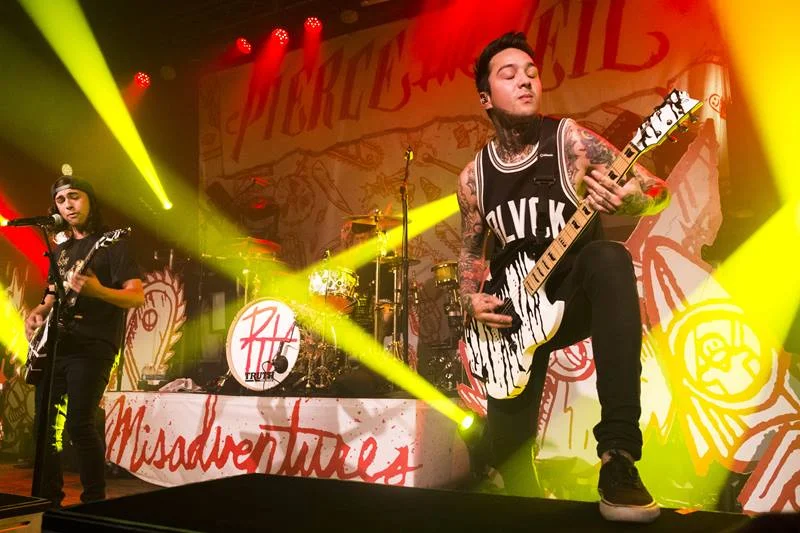 Live stage shot during the "Misadventures" Tour. We wanted the tour to continune with the album imagery seamlessly so I designed giant prop versions of various album art elements that reflect different somgs.