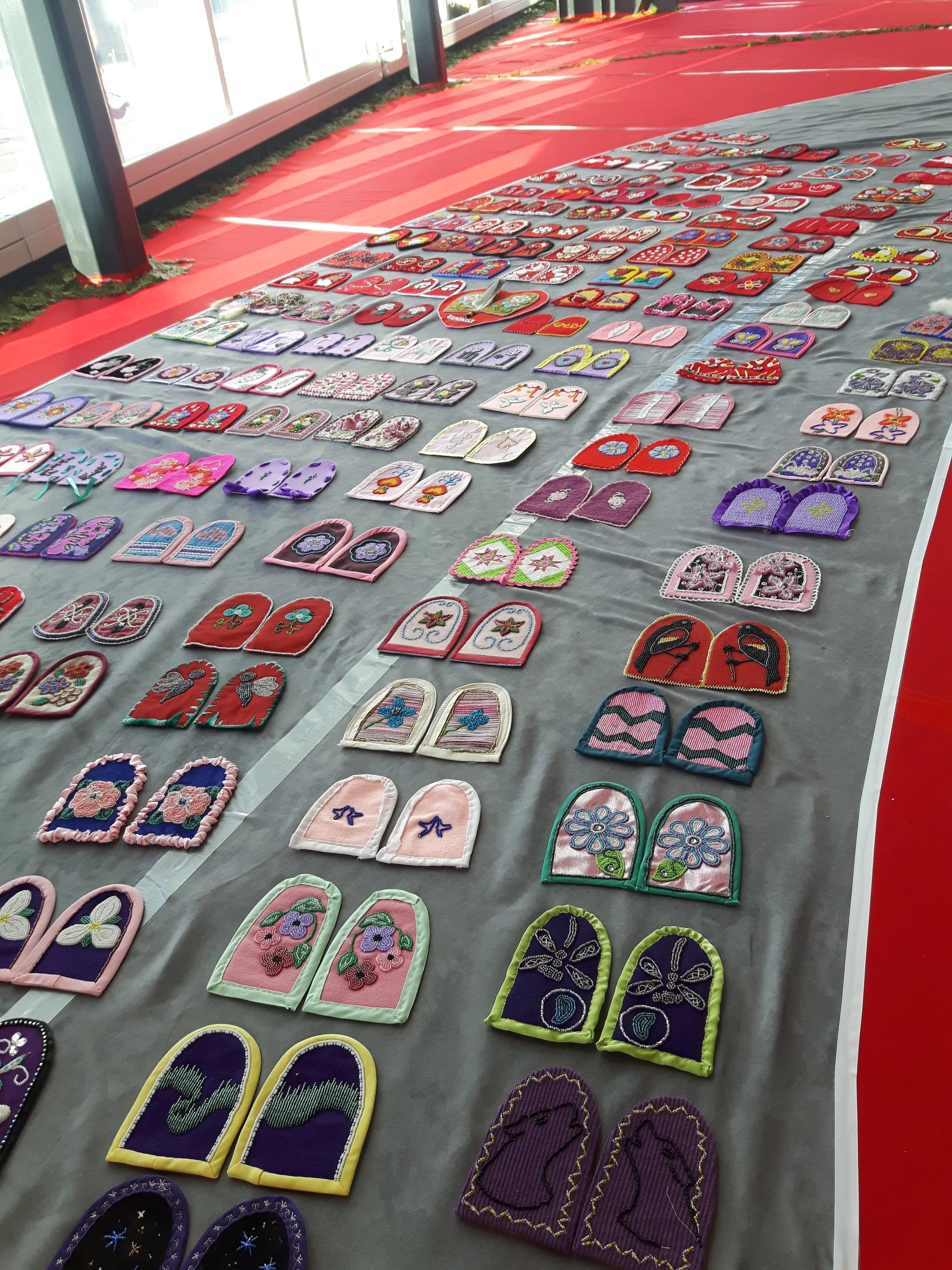 Installation of moccasin vamps for Walking With Our Sisters at the McEwan School of Architecture, Laurentian University, Sudbury, ON, 2018. Photograph by Tracy Bear