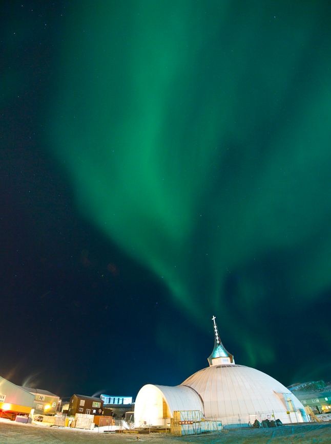 St.Jude’s Cathedral, Iqualuit, Nunavut, with the northern lights. Harriet Burdett-Moulton for Santec Architects, 2011. Photo courtesy of NCC Development Ltd.