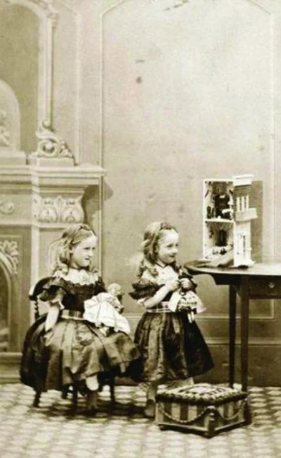 Image 3 / Victorian girls playing with their dolls and dollhouse, 1862. Getty Images